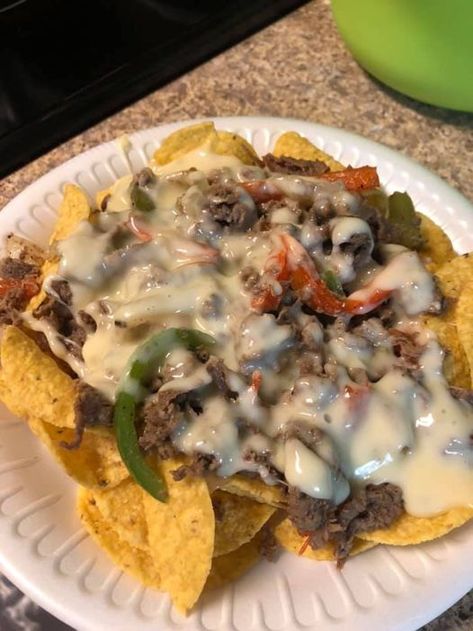 Philly Cheesesteak Nachos for dinner - Recipes on a Budget Cheesesteak Nachos, Nachos For Dinner, Shaved Steak, Steak Nachos, Mexican Dinners, Nachos Ingredients, Sauteed Peppers And Onions, Recipes On A Budget, Nacho Chips