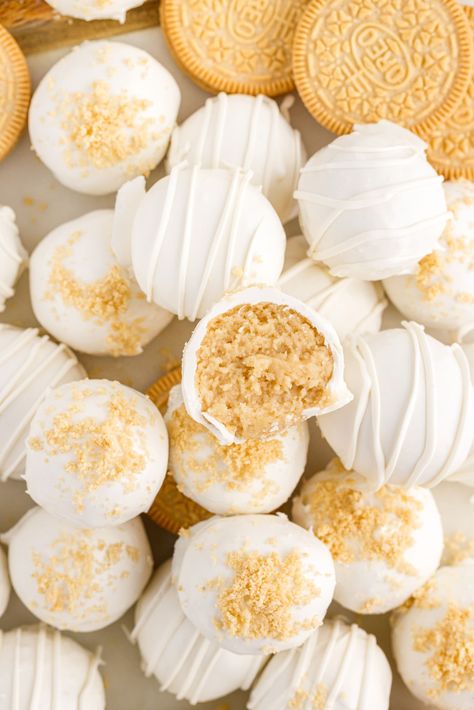 Oreo cookies, white chocolate wafers, and cream cheese are all you need to make these decadent little Golden Oreo truffles. These golden morsels of sweet delight go down in one poppable bite, and they're perfect for every occasion! Golden Oreo Cake Pops, White Oreo Truffles, Birthday Oreo Balls, Golden Oreo Santa Cookies, White Chocolate Oreo Balls, Vanilla Oreo Balls, Golden Oreo Cookie Recipes, White Oreo Balls, Golden Birthday Treats