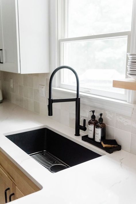 Add a bold statement in your kitchen with a black quartz sink and matte black faucet.

Photo/design: @giulianodesigns

#kitchenremodel #kitchendesign #homedecor #homedesign #homeremodel Black Farmhouse Sink With Gray Cabinets, Black Sink Kitchen White Counter, Black Kitchen Sink With White Countertop, Black Finishes Kitchen, Black Home Fixtures, Black Kitchen Sink Faucet Ideas, Black Tap Kitchen Sinks, Black Kitchen Faucet Gold Hardware, Large Black Kitchen Sink