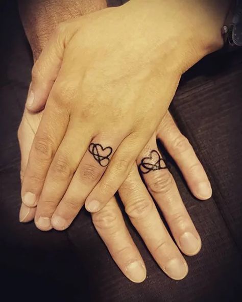 60 Best Love Tattoos that will Definitely Melt Your Heart in 2021 Infinity Ring Tattoos, Heart Ring Tattoo, Infinity Ring Tattoo, Wedding Ring Tattoo Ideas, Wedding Ring Finger Tattoos, Ring Tattoo Ideas, Wedding Ring Tattoos, Heart With Infinity Tattoo, Tattoo Rings