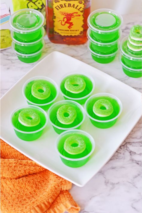 These Green Apple Fireball Jello Shots will take your parties to a whole new level. The addition of delicious cinnamon flavor whiskey to traditional jello shots make for a super fun adult treat that's always a hit! Sonic Green Apple Jello Shots, Green Apple Jello Shots Recipes, Fireball Jello Shots, Jell O Shots, Jello Shot Recipes, Jello Shot, Party Starters, Hot Tamales, Poison Apples