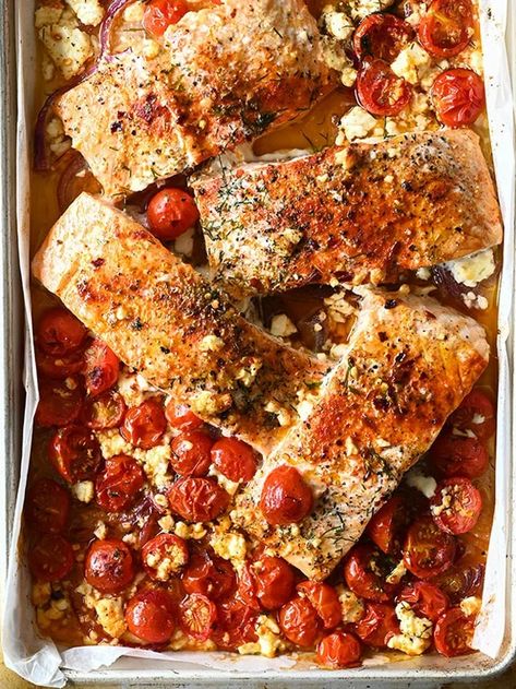 Greek style baked salmon - An effortless sheet pan recipe with feta, cherry tomatoes and aromatic spices. Fuss-free, ready in 25 minutes. Serving Dumplings, Weeknight Dinner Ideas, Fish Meals, Cherry Tomato Recipes, Fish Dinner Recipes, Breakfast Soup, Seafood Entrees, Pan Recipe, Garlic Salmon