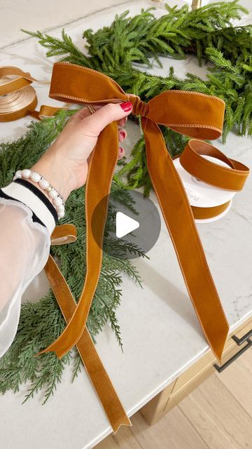 Kasey Dixon on Instagram: "DIY \ how-to tie a holiday BOW✨ Taking my wired velvet ribbon from Amazon and showing y’all how to do it🎀 Making sure the velvet is facing YOU! Try it with me! I use these all around the house on my Christmas wreaths, stairway garland and swags. Happy BOW making!xx

Comment BOW below to receive a DM with the link to shop this post on my LTK 🔗🔗 https://liketk.it/4WCEf

#bowseason #bows #christmasbow #howtotieabow #bowtutorial #christmasbows #christmasbow #amazonhome #amazonhomefinds" How To Make A Flat Bow With Ribbon, Tying A Bow For A Wreath, Cowboy Hat Christmas Wreath, Wire Edged Ribbon Bow Diy, Christmas Garland With Velvet Ribbon, Wreath Bows How To Make Easy, Tie Velvet Ribbon Bow, Velvet Bow On Wreath, Velvet Bow Garland Diy