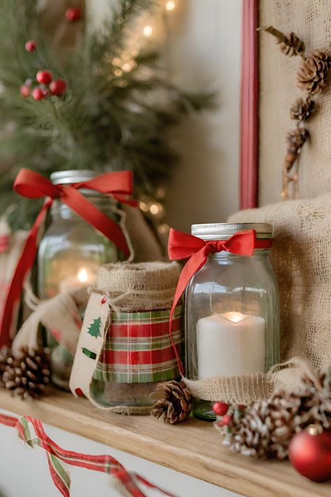 Embrace the charm of a rustic farmhouse Christmas with DIY wooden ornaments, burlap ribbons, and a palette of red, green, and natural wood. Use mason jars filled with fairy lights to add a warm glow and complete the look with a homemade garland featuring pinecones and berries. #Jars #christmas #trend Diy Wooden Ornaments, Homemade Garland, Decorating Candle Jars, Rustic Farmhouse Christmas, Every Aesthetic, Candle Jar, Burlap Ribbon, Wooden Ornaments, Farmhouse Christmas