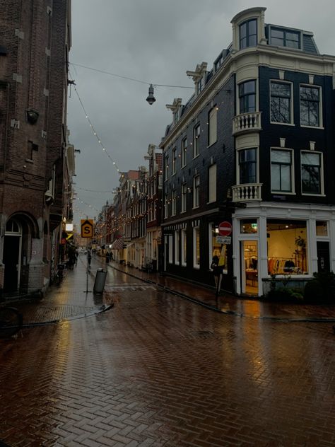 rainy, dark, buildings, street, vibe, lights, cloudy, grey Amsterdam Rainy Day, Amsterdam Street Photography, Amsterdam Night Life, Rainy Street Aesthetic, Rainy Amsterdam, Netherlands Aesthetic, Day In Amsterdam, Amsterdam Winter, City Sidewalk