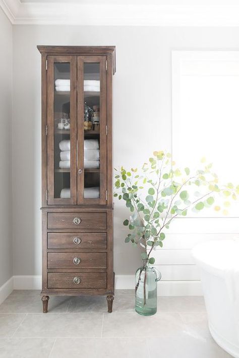 The Restoration Hardware Maison Tall Bath Cabinet, graces a bathroom with a distressed, rustic storage unit. Pure Salt Interiors, Regal Design, Transitional Bathroom, Bath Cabinets, Linen Cabinet, Vintage Bathrooms, Large Bathrooms, Vintage Cabinets, Half Bathroom