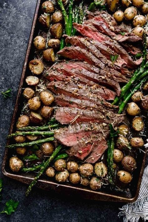 Sheet Pan Parmesan Steak and Potatoes | A simple meat and potatoes dish gets a convenient and flavorful upgrade thanks to garlic and parmesan in this weeknight-perfect Sheet Pan Parmesan Steak and Potatoes meal. It’s simple enough for everyday yet impressive enough for a date night in or special occasion. || The Real Food Dietitians One Pan Steak Dinner, Sheet Pan Steak, Sheet Pan Steak Bites And Potatoes, Steak And Asparagus Sheet Pan Dinner, Garlic Herb Steak And Potatoes, Sheet Pan Steak Potatoes And Asparagus, Parmesean Potatoes, Roasted Asparagus And Potatoes, Chicken Potato Asparagus Sheet Pan