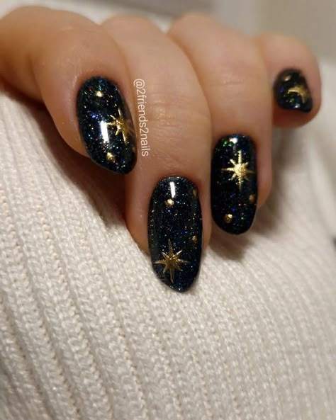 With sparkles, gold, silver, or fun holiday designs, New Year’s Eve nails can help you feel extra fabulous as you welcome a new beginning. Here are 50 nail ideas to inspire your next holiday manicure. Night Sky Themed Nails, Moon Star Nails Design, Navy Celestial Nails, Dark Celestial Nails, Moon And Stars Nail Designs, Nail Designs Celestial, Short Celestial Nails, Midnights Era Nails, Solar Eclipse Nails