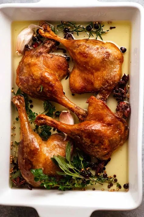 Duck Confit in a white baking dish Roasted Duck Leg, Whole Duck Confit, Duck Thigh Recipes, Braised Duck Recipes, Duck Confit Plating, Christmas Duck Recipes, Duck Leg Recipes, Duck Confit Recipe, Confit Duck Leg