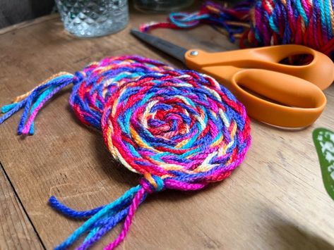 DIY No-Sew Rainbow Braided Yarn Coasters Yarn Coasters Diy, Craft With Yarn, Braided Coasters, Yarn Craft Ideas, Yarn Lanterns, Yarn Coasters, Yarn Keychain, November Art, Yarn Pom Poms