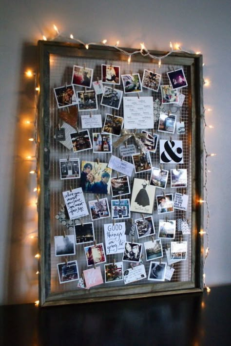 By removing the glass interior and adding wire, you can elevate an old frame into a beautifully crafted photo collage-esque display. Bonus: Add string lights around the frame to create a soft glow. Get the tutorial at Anastasia Co.   - CountryLiving.com Diy Mood Board, Photo Collage Diy, Diy Dorm Decor, Dorm Diy, Polaroid Wall, Old Picture Frames, בר מצווה, Photo Board, Decoration Photo