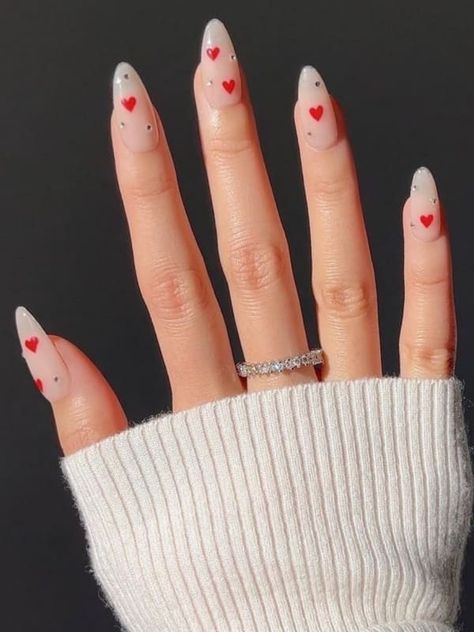 almond-shaped, milky nails with red hearts and rhinestones Hearts And Rhinestone Nails, Nails With Hearts And Rhinestones, Milky White Nails With Red Hearts, Milky Nails With Hearts, Valentines Day Nails With Rhinestones, French Tips With Rhinestones, Latest Nail Trends, Milky Nails, Nude Nail Designs