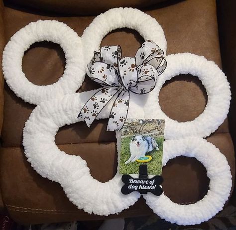 Dollar Tree Fanatics Crafts & Decor | I made this paw print wreath for my son, using one heart wire frame, four small round wire frames & clear zip ties from DT | Facebook Paw Print Wreath Diy Dollar Tree, Dollar Tree Dog Paw Wreath, Wire Heart Wreath Ideas, Paw Wreath Diy, Paw Print Wreath Diy, Dog Paw Wreath Diy, Dollar Tree Heart Wreath Diy, Dog Paw Wreath, Heart Wreath Frame