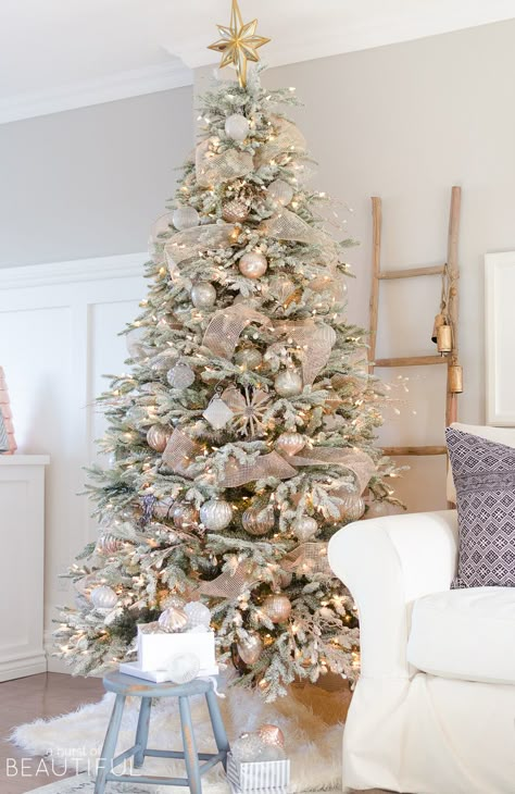 A snowy flocked Christmas tree decorated in silver and rose gold adds a big dose of holiday cheer to this modern farmhouse living room Flocked Christmas Trees Decorated, Rose Gold Christmas, White Christmas Trees, Flocked Christmas Trees, Christmas Tree Inspiration, White Christmas Decor, Cool Christmas Trees, Oh Christmas Tree, Christmas Living Rooms