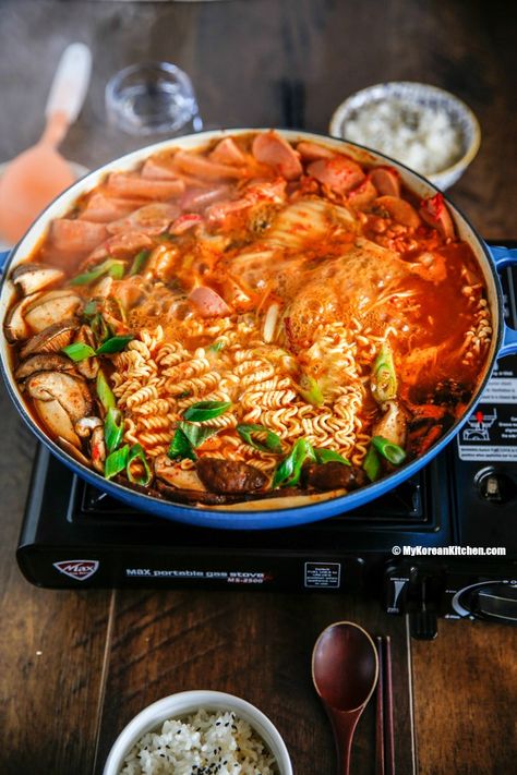 Korean army stew (Budae Jjigae) is a Korean fusion hot pot dish loaded with Kimchi, spam, sausages, mushrooms, instant ramen noodles and cheese. The soup is so comforting and addictive! | MyKoreanKitchen.com Ramen Ideas, Budae Jjigae, Winter Stew, Korean Army, Recipe Korean, Soup Ideas, Korean Kitchen, Lovely Pic, Ramen Recipe