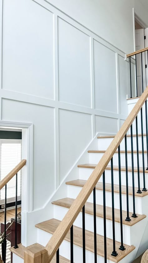 #crafts #stairsmakeover #renovation Stair Batten Board, Tall Board And Batten Entryway, Wall Paneling Under Stairs, Batten Board Walls With Crown Molding, Board Batten Staircase, Upstairs Hallway Board And Batten, Board And Batten Wall On Staircase, Modern Colonial Stair Railing, Colonial Board And Batten