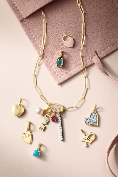 Transform your daily look into a magical experience with charming details and enchanting enameled accents. Embrace the extraordinary in your everyday style!🤍 Click through to find the perfect Valentine's Day styles. Bracelet Ideas Photography, Jewellery 2024 Trends, Jewelry Valentines Day Campaign, Valentine’s Day Jewelry, Charms Photography, Necklace Photography Ideas, Valentine Jewelry Ideas, Jewellery Social Media, Charm Photography