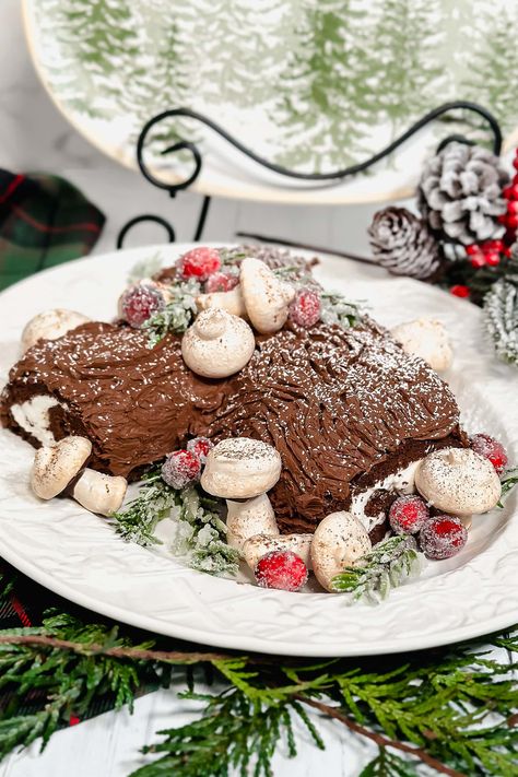 This festive Yule Log, a traditional rolled, flourless Christmas cake, is filled with luscious whipped cream and adorned with bark-like etchings of decadent chocolate buttercream frosting. The simple-to-create meringue mushrooms add a charming touch, bringing this woodland cake to life. Cake Cream Filling, Meringue Mushrooms, Yule Log Cake, Woodland Cake, Chocolate Buttercream Frosting, Creme Egg, Yule Log, Chocolate Buttercream, Decadent Chocolate