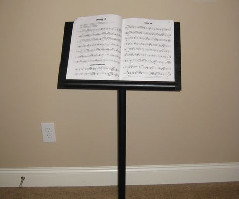 My girlfriend is a music major and she needed a music stand in order to practice. As it turns out, music stands aren't cheap, so I decided to build her one from some parts lying around my basement. (I did have to buy a few things). Music Major, Craft Fair Booth Display, Sheet Music Stand, Book Art Sculptures, Music Stands, Baroque Furniture, Craft Fairs Booth, Piano Room, Make Music