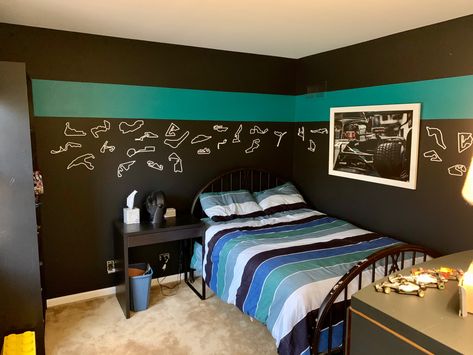 The theme I painted for my son’s bedroom: mercedes colors and formula 1. SW 6941 nifty turquoise. SW 7657 Tinsmith. SW 6992 Inkwell. Bedding is pottery barn teen kelly slater organic tide stripe. And cut-out race tracks and framed poster of lewis hamilton from etsy. F1 Themed Bedroom, Formula 1 Bedroom Ideas, F1 Bedroom Ideas, Formula 1 Bedroom, F1 Bedroom, L Bedroom Ideas, Formula 1 Room, Racing Bedroom, F1 Room