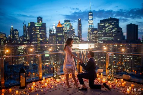 Glowing candles and flower petals on a rooftop in front of the New York City skyline New York Proposal Ideas, Rooftop Proposal Decorations, New York City Proposal, Balcony Proposal, Rooftop Proposal Ideas, Wedding Dinner Decorations, Candlelit Proposal, Candlelight Proposal, Sadie Kincaid