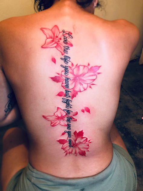 Spine Tattoos Dragon For Women, Cute Tattoos For A Lost Loved One, Unique Spine Tattoos For Women Flower, Japanese Cherry Blossom Spine Tattoo, Bible Back Tattoo, Flowers On Spine Tattoo, Spine Tats Red Ink, Red Flower Back Tattoo, Back Tattoos Red Ink