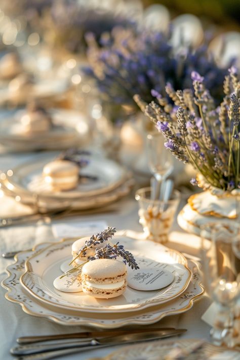 Immerse your guests in the charm of Southern France with these delightful wedding favors. Lavender sprigs meet sweet macarons for a memorable take-home treat. Perfect for a chic countryside vibe. 🌿💜🍰 #WeddingInspiration #FrenchWedding #LavenderLove #MacaronFavor #ProvencalStyle #RomanticWedding #WeddingDetails #ElegantWedding Provencal Wedding Theme, French Blue And Lavender Wedding, French Wedding Favors, French Countryside Bridal Shower Ideas, Provence Themed Party, Lavender Aesthetic Wedding, French Country Wedding Theme, Purple And Gold Wedding Theme, Lavanda Wedding