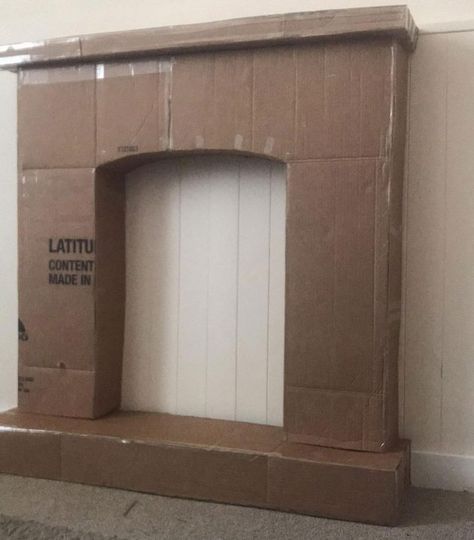 This DIY cardboard fireplace idea is really thinking outside the box! Diy Cardboard Fireplace, Faux Fireplace Diy Cardboard, Fake Fireplace Diy, Real Fireplace, Diy Christmas Fireplace, Cardboard Fireplace, Decorative Fireplace, Fake Fireplace, Faux Fireplace Diy