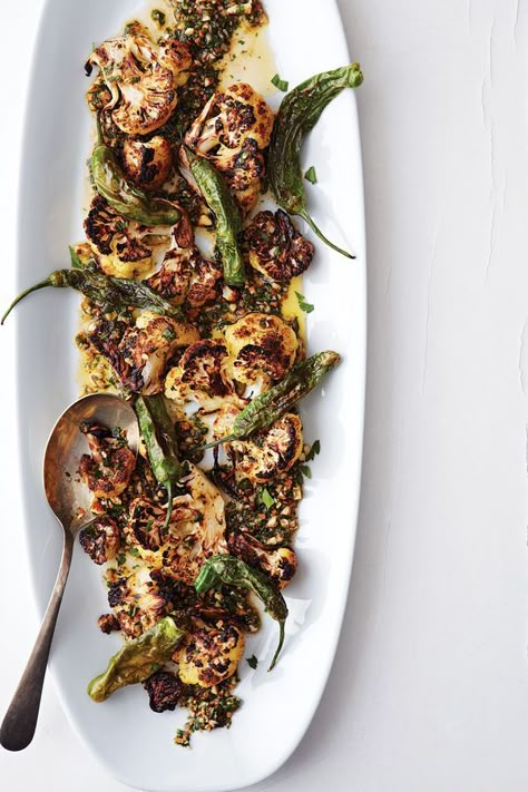 Saveur (March 2015) Bittens, we're going to Spain! We are so excited! Neither of us has been before, but Spain has long been at the top of our list of destinations to visit. We're hitting three main areas: Barcelona, the... Shishito Pepper Recipe, Charred Cauliflower, Shishito Peppers, Tapas Recipes, Buffalo Cauliflower, White Plate, Peppers Recipes, Cauliflower Recipes, Veggie Dishes