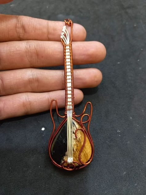 Wire Wrapped Guitar Pendant, Heavy Metal Accessories, Guitar Picks Crafts, Wire Wrapped Guitar, Guitar Picks Diy, Guitar Jewelry, Guitar String Jewelry, Braided Bracelet Diy, String Jewelry