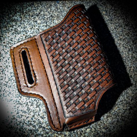 Dark brown leather cell phone case with a skull basket weave pattern going diagonal indirection. Perfect for wearing your phone on your hip. Leather Phone Holster Pattern, Leather Cell Phone Holster, Leather Phone Holster, Pancake Holster, Leather Cell Phone Cases, Guitar Straps, Tablet Cases, Tool Belt, Knife Sheath