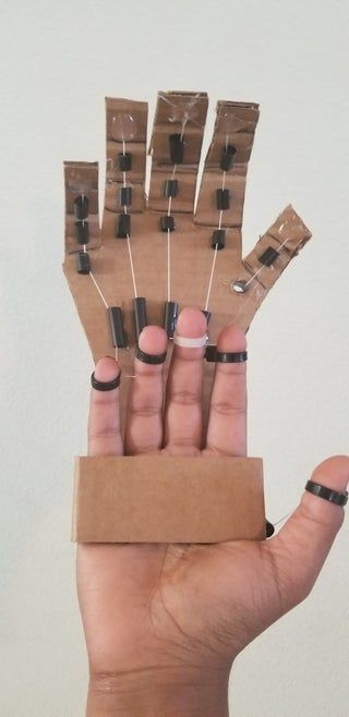 DIY Cardboard Mechanical Hand : 4 Steps - Instructables Diy Engineering Projects, Cardboard Speaker, Cardboard Tutorial, Cosplay Making, Origami Insects, Cardboard Creations, Glue Stick Crafts, Mechanical Projects, Box Crafts