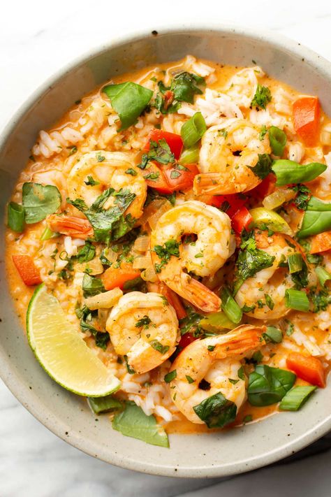 Busy weeknights are made for this Thai shrimp curry recipe! It's simple to make, and there's plenty of the rich coconut red curry sauce with fresh herbs to serve over rice. Thai Seafood Curry, Red Curry With Shrimp, Shrimp Coconut Rice, Shrimps With Rice, Red Curry Shrimp Thai Coconut Milk, Thai Coconut Shrimp Curry, Shrimp And Jasmine Rice Recipes, Prawn Curry With Coconut Milk, Shrimp Curry Recipe Thai