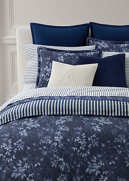 Rendered on cotton percale, the Caterina duvet cover set offers a striking interpretation of classic blue-and-white florals with youthful tossed botanicals printed across a rich indigo ground. Indigo Background, Navy Bedding, Dark Blue Bedrooms, White Bedroom Decor, L King, Striped Duvet, Blue White Decor, Chic Bedding, Queen Duvet Cover