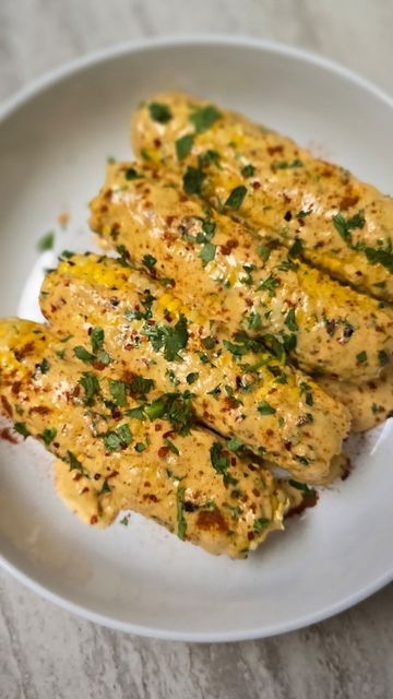 Natasha Laggan on Instagram: "Creamy Cajun Corn - you will be addicted to this 😃 This is a highly requested video !!! Pan - @ourplace  4 CORN ON THE COB WHOLE / PIECES 2 TBSP UNSALTED BUTTER 1 TBSP MINCED GARLIC 1 TSP PIMENTO FLAKES / CHILI FLAKES  1/2 TSP CAJUN SEASONING 1/4 TSP PAPRIKA 1 CUP HEAVY CREAM /COOKING CREAM 2 TBSP PARMESAN 1 TBSP PECORINO 1 TBSP CHOPPED CILANTRO / PARSLEY EXTRA SEASONINGS FOR GARNISHING - OPTIONAL" Cajun Creamy Garlic Corn On The Cob, Creamy Cajun Corn On The Cob, Cajun Creamy Garlic Corn, Cajun Corn On The Cob, Cajun Corn, Cilantro Parsley, Cajun Butter, Buttered Corn, Corn Dishes