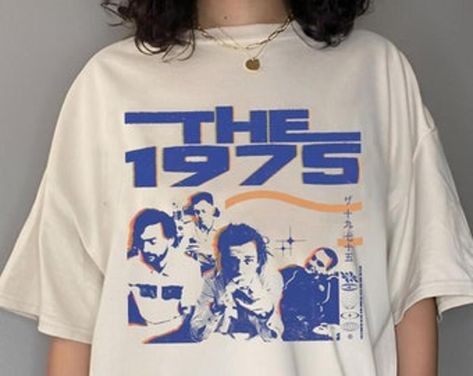 The 1975 Vintage Graphic T-shirt Fan Gifts Check more at https://redfoxpod.com/product/the-1975-vintage-graphic-t-shirt-fan-gifts/ The 1975 Merch, The 1975 T Shirt, 1975 Band, The 1975 Shirt, Reunion Shirts, Merch Ideas, Space Lovers, Air Supply, Graphic Tshirt Design