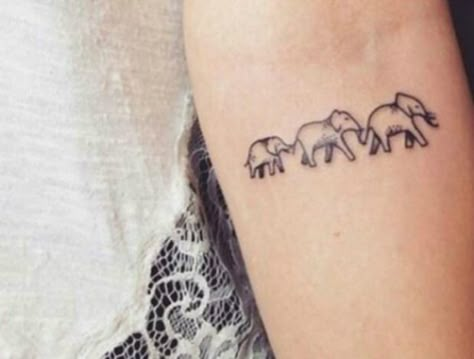 The  leader of a group of elephants is always an older female who fiercely protects and guides the young. This tattoo reminds you of the powerful, loyal woman with deep family values that you are. Tiny Elephant Tattoo, Elephant Tattoo Design, Small Tattoos With Meaning, Sister Tattoo, Sibling Tattoos, Family Tattoo, Geniale Tattoos, Delicate Tattoo, Elephant Tattoo