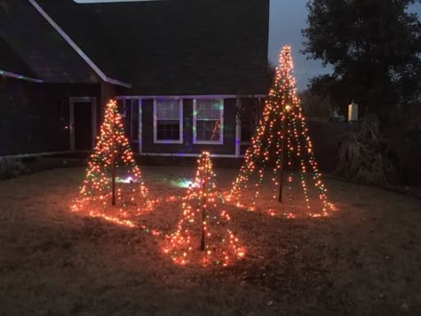 Here is an easy idea to light up your yard for Christmas without spending a lot of time and money. We spent $25-$30 and made three trees.#diy #christmas #decor #backyard Christmas Backyard, Lighted Trees, Pallet Wood Christmas Tree, Backyard Lights, Pallet Wood Christmas, Outdoor Christmas Diy, Christmas Outdoor Decorations, Christmas Lights Outdoor, Christmas Outside