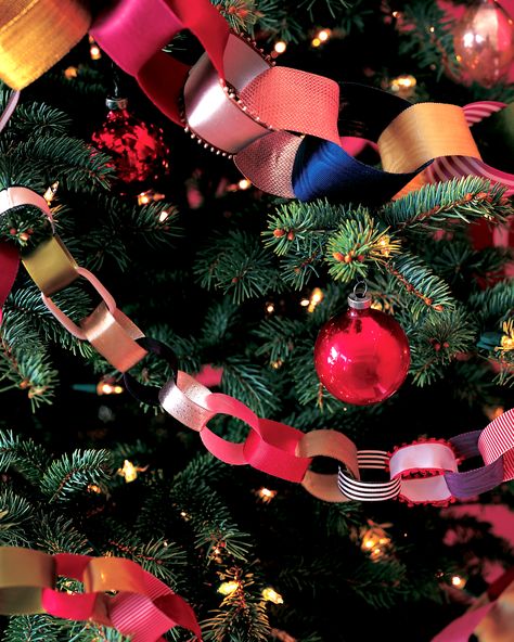 DIY Christmas Tree Garland Ideas to Personalize Your Holiday | Sorry tinsel, your time is over. These festive embellishments are the perfect garland to adorn your Christmas tree. Here's a cost-effective recyclable option: use paper ribbons from gifts to craft this decorative chain-and keep adding for years to come!  #christmas #crafts #marthastewart #DIYdecor Christmas Tree Ribbon Garland, Diy Christmas Tree Garland, Christmas Tree Garland Ideas, Tree Garland Ideas, Garlands Christmas, Diy Garlands, Diy Christmas Garland, Garland Ideas, Christmas Garlands