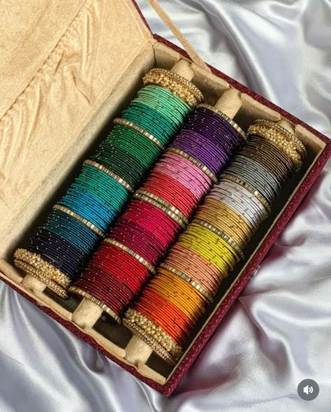 Thread bangles combo box dispatched 💟 Full combo in 1st picture- 1999₹ Box for ₹799 2nd picture combo - 24 colours- 1 dozen each bangles at just ₹1350 Size 2.2 to 2.10 available ✨ -colours may vary in combo boxes -bangle box may have slight imperfections as it is handmade -pls ask for size chart if there is confusion for bangle size. We use global sizes only. No size exchange available . #combobox #banglescombo #diwalibangles #karvachauthspecial #banglesbox #customisedbangles #velvetban... Bangles Set Designs, Bangles Box Ideas, Bangles Aesthetic, Jhumka Bangles, Bangle Collection, Silk Thread Bangles Design, Silk Bangles, Thread Bangles Design, Bridal Jewellery Inspiration