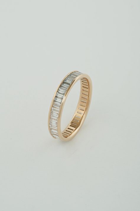 The North South Baguette Band is a channel set band composed of north-south facing white diamond baguettes. The band is eternity style, which means diamonds wrap around the entire exterior of the band. A little deco, a touch modern, this piece is perfect to tie a stack of rings together, compliment a vintage engagement ring, or really stand out on its own. Our Baguette pieces are made with recycled natural diamonds. All diamonds are G-H Color, and VS Clarity. Bands can be matched to a center sto Baguette Wedding Band, Baguette Band, Baguette Diamond Rings, North South, Emerald Engagement Ring, Vintage Engagement, Channel Set, Dream Ring, Anniversary Bands