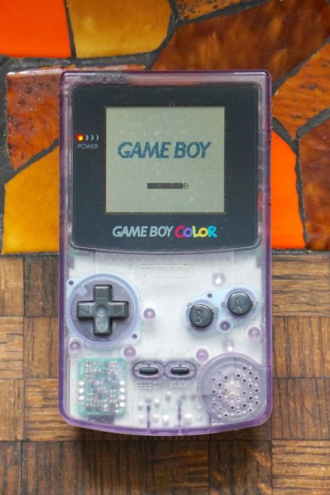 Authentic 1998 clear Atomic Purple Gameboy Color! This Gameboy requires headphones - the sound that comes out of the speaker without headphones is extremely quiet, almost to the point where you can't hear it. With headphones games sound great. Power button and volume control work (volume control works with headphones). There is some weird watermark stains on the screen - see picture 8. I've tried to remove them with no luck. Clear Gameboy, Pretty Alien, 2000s Tech, Gaming Nostalgia, Gameboy Color, Nintendo Gameboy, Great Power, Power Button, Game Boy