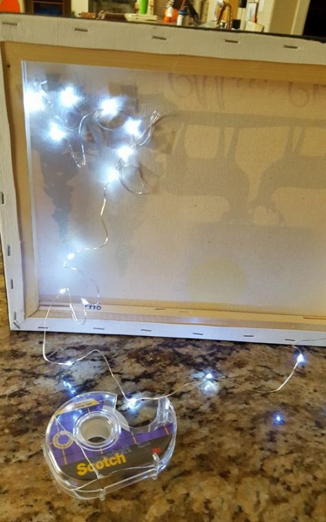 DIY Light Up wall decor Htv On Canvas, Canvas Light Art, Lighted Canvas Pictures, Christmas Projects To Make, Cheap Christmas Decor, Cricut Christmas Projects, Light Up Canvas, Lighted Canvas Art, Diy String Lights