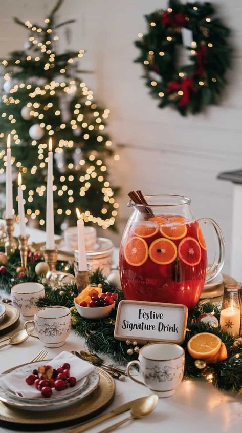 18 Best Christmas Party Ideas Festive holiday table with a signature drink, candles, and Christmas decor for a cozy seasonal celebration. | Sky Rye Design Womens Holiday Party Ideas, Flannel And Fizz Christmas Party, Christmas Party Serving Table Ideas, Cocktail Christmas Party Decor, Christmas House Party Decorations, Christmas Party Bar Ideas, Intimate Christmas Party, Hosting A Holiday Party, Christmas Dinner Party Ideas Decor