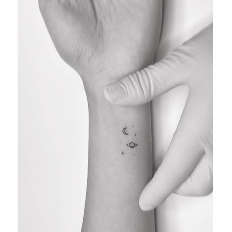 Minimalistic style Saturn, moon and stars tattoo Astronomy Tattoos, Moon And Stars Tattoo, Playground Tattoo, Astronomy Tattoo, Community Tattoo, Maching Tattoos, Saturn Tattoo, Small Moon Tattoos, International Tattoo