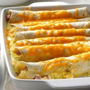 Breakfast Burrito Casserole Recipe | Taste of Home Breakfast Enchilada Casserole, Breakfast Enchiladas Casserole, Casserole With Ham, Make Ahead Brunch Recipes, Mexican Brunch, Burrito Casserole, Make Ahead Brunch, Breakfast Enchiladas, Chicken Shawarma Recipe