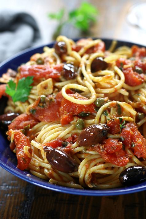 Spaghetti alla Puttanesca is an incredibly simple dinner that is perfect for busy weeknights. This authentic Italian recipe has delicious flavors of garlic, capers, anchovies, olives and tomatoes. Pasta lovers adore this recipe! #Puttanesca #SpaghettiPuttanesca #AuthenticItalianPasta https://www.thefedupfoodie.com Authentic Italian Pasta Recipes, Pasta Puttanesca Recipe, Italian Pasta Recipes Authentic, Puttanesca Recipe, Authentic Italian Pasta, Spaghetti Alla Puttanesca, Puttanesca Sauce, Alla Puttanesca, Pasta Puttanesca