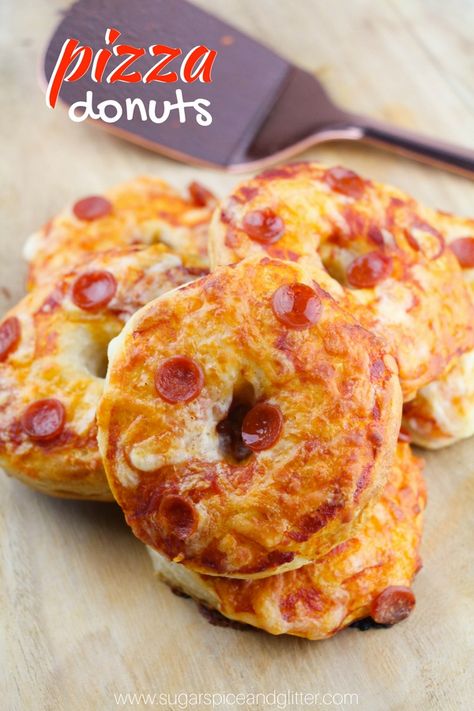 A fun pizza night recipe, these Pizza Donuts are simple enough for kids to make and a fun party recipe everyone will love! Pizza Donut Recipe Every Friday is family night in our house. Whether we’re doing a night of crafts, or board games – or a fun themed movie night – no matter what, … Pizza Donut Recipe, Donut Pan Recipe, Savory Donuts, Pizza Donuts, Donut Theme Party, Pizza Slider, Doughnut Party, Donut Themed Birthday Party, Kids Pizza