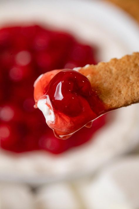 Cherry Cheesecake Dip is the perfect blend of appetizer and dessert dip, with cream cheese, powdered sugar, and cherry pie filling. Cherry Cheesecake Dip Recipe, Cherry Cheesecake Dip, Cheesecake Dip Recipe, Dips Sweet, No Bake Cherry Cheesecake, Dessert Dip, Cream Cheese Dip, Chocolate Souffle, Cheesecake Dip