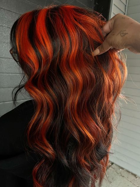 Bold and Beautiful: Red Highlight Hair Ideas to Try Now Black With Orange Hair, Neon Orange Highlights, Black Hair With Orange Streaks, Orange Hair With Black Highlights, Orange Hair With Black Streaks, Alt Fall Hair, Chunky Orange Highlights, Halloween Colored Hair, Halloween Dyed Hair